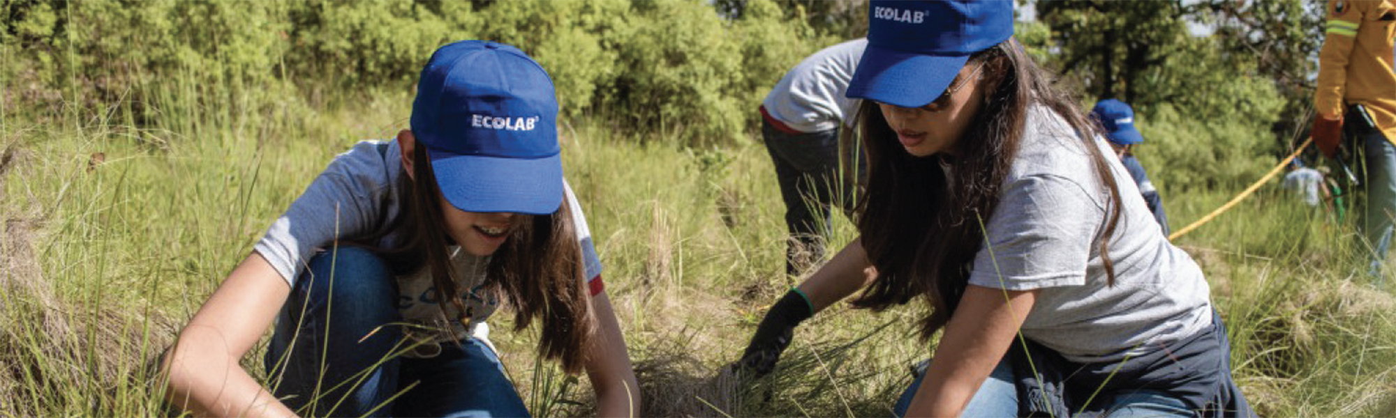 Two Ecolab associates working in the grass at Mexico Plant Certified as Water Stewardship Leader